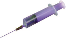 An uncovered syringe with purple liquid inside.