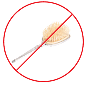 Hair brush with a stop sign overlayed.