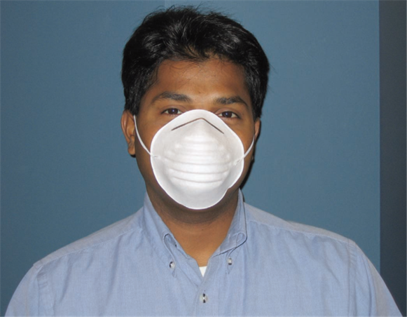 Worker wearing a dust mask to protect himself against dust, germs and other things.