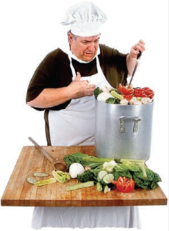 Chef cuisinier  - Image d'un chef cuisinier cuisinant des légumes. Il porte un tablier blanc.